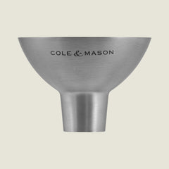 The Cole & Mason Dover Stainless Steel Funnel is an easy-to-clean kitchen essential, designed for effortless pouring and featuring signature Cole & Mason branding against a light, pale background.