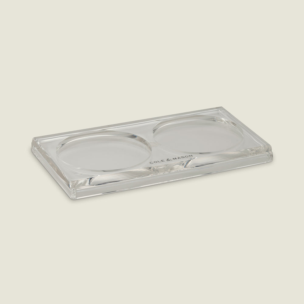 The Cole & Mason Ramsgate Acrylic Mill Tray features a clear rectangular design with two round indents for holding Salt and Pepper Mills, and has Cole & Mason printed at the edge to suit any light kitchen background.
