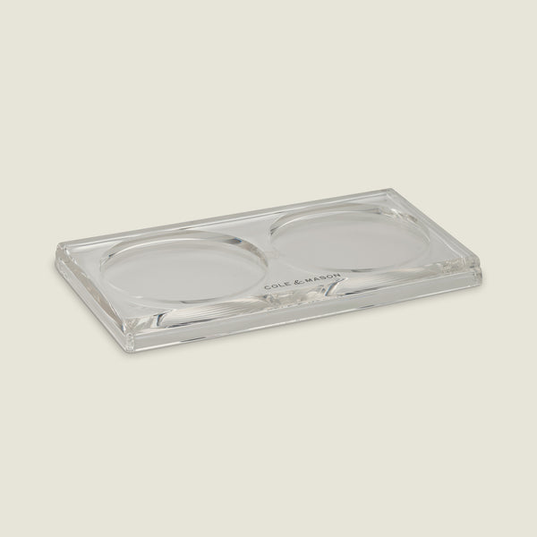 The Cole & Mason Ramsgate Acrylic Mill Tray features a clear rectangular design with two round indents for holding Salt and Pepper Mills, and has Cole & Mason printed at the edge to suit any light kitchen background.