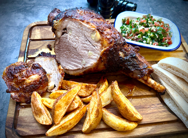 Easter Lamb with Pitta Breads, Spicy Potato Wedges and Fresh Salad