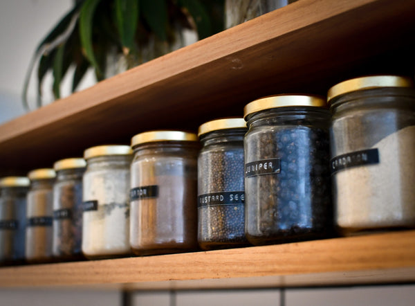 shelf with jars of spices to add flavour to food 