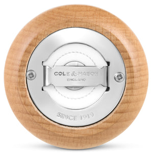 Bottom view of the Cole & Mason King Pepper Baseball Bat Pepper Mill 710mm, displaying a round wooden base with a silver carbon steel mechanism engraved “Cole & Mason England” and “Since 1919,” secured by two screws; features an adjustable grind for customized seasoning.