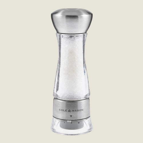 #salt
The Cole & Mason Windermere Pepper Mill 165mm features a clear and stainless steel design, a ceramic mechanism, and adjustable grind setting at the base, styled after premium acrylic mills.