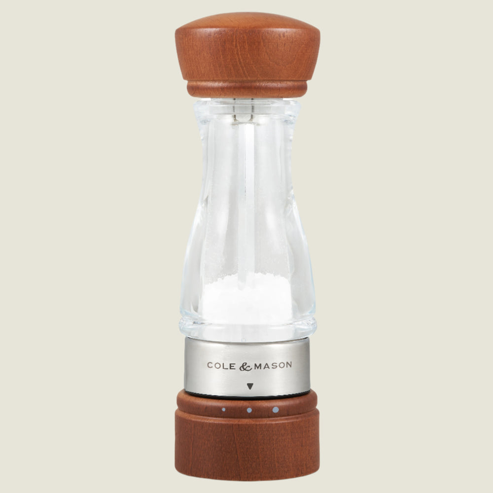 #salt
The Cole & Mason Keswick Salt & Pepper Mills feature a clear, durable acrylic body with a forest stained wood top and base, filled with salt, and finished with a metal band—ideal for gourmet seasoning.
