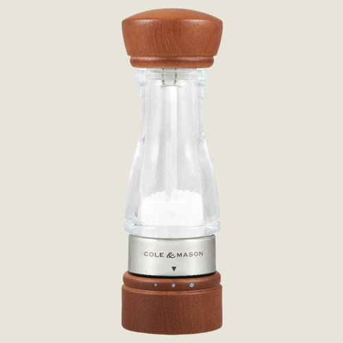 #salt
The Cole & Mason Keswick Salt & Pepper Mills feature a clear, durable acrylic body with a forest stained wood top and base, filled with salt, and finished with a metal band—ideal for gourmet seasoning.