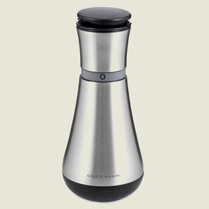 The Cole & Mason UK Henley Oil & Vinegar Pourer 180mm features a sleek, modern carafe design with a black top and base, plus a visible adjustment ring near the top.