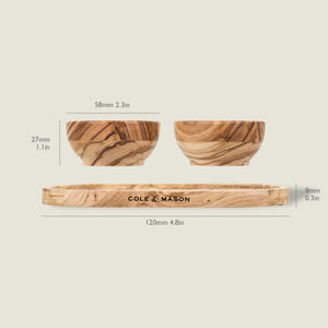 The Cole & Mason Portobello Olive Wood Pinch Pot Set includes two 58mm x 27mm bowls and a 120mm x 8mm tray. Each features unique grain patterns, making every piece distinct. All measurements are labeled.