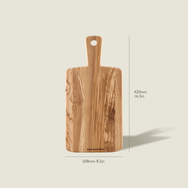 The Cole & Mason Portobello Olive Wood Serving Boards Set features a rectangular board with a handle, shown upright against a light background. Dimensions: 420mm (16.5in) height and 208mm (8.2in) width.