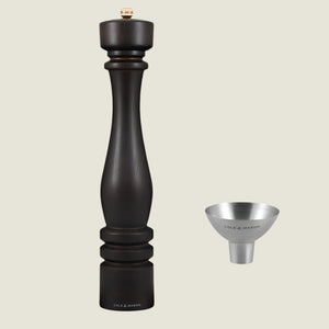 The Cole & Mason London Chocolate Wood Pepper Mill 400mm and silver refill funnel are elegantly displayed against a light background, both branded and beautifully presented in a luxury gift box.