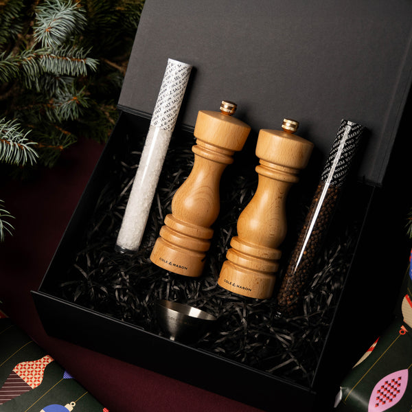 The London Natural Beech Mill Christmas Gift Hamper by Cole & Mason includes a salt & pepper mill set, two test tubes of salt and pepper, and a metal funnel—perfectly festive for holiday gifting.