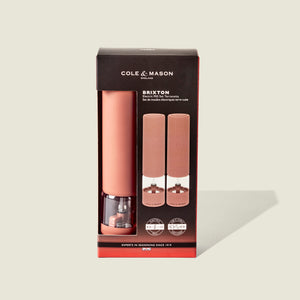 Cole & Mason Brixton Electric Mill Terracotta GS, featuring a premium ceramic grinding system, packaged in a black and clear box with product images and branding on the front.