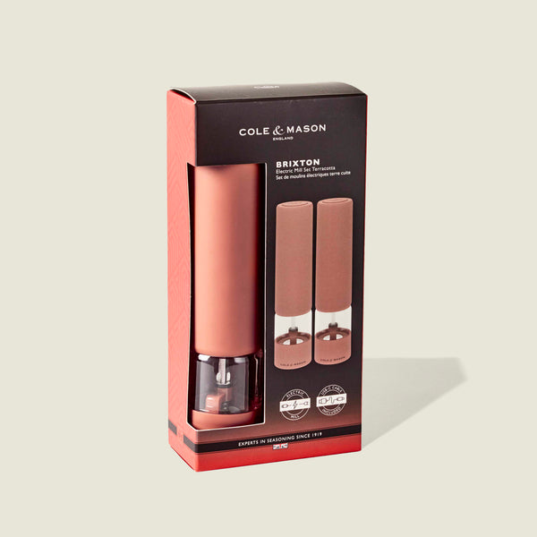 Cole & Mason Brixton Electric Mill Terracotta GS, presented in a black and red box with a window showcasing the two matching grinders. Each mill features a durable ceramic grinding system for smooth, precise seasoning every time.