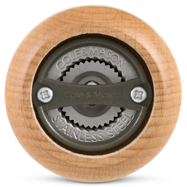 Close-up view of the bottom of the Cole & Mason King Pepper Baseball Bat Pepper Mill 710mm, highlighting its stainless steel grinding mechanism engraved with Cole & Mason and Stainless Steel.