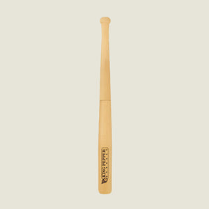A 710mm King Pepper Baseball Bat Pepper Mill by Cole & Mason UK stands upright on an off-white background, its light natural finish features a Tiny Peppy logo near the bottom and a design inspired by the classic King Pepper mill.