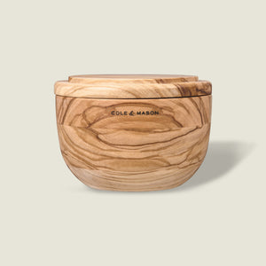 The Portobello Olive Wood Salt Cellar by Cole & Mason features natural grain patterns, a matching lid, and the brand logo on the front, adding timeless charm to your kitchen decor. Shown against a plain light background.