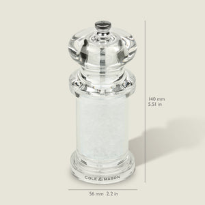 #salt
A clear acrylic Cole & Mason 505 Salt & Pepper Mill, filled with coarse salt and adjustable for precise grinding. Measures 140mm tall by 56mm wide. Shown against a light background with measurement lines.