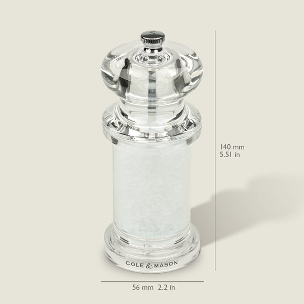 #salt
A clear acrylic Cole & Mason 505 Salt & Pepper Mill, filled with coarse salt and adjustable for precise grinding. Measures 140mm tall by 56mm wide. Shown against a light background with measurement lines.