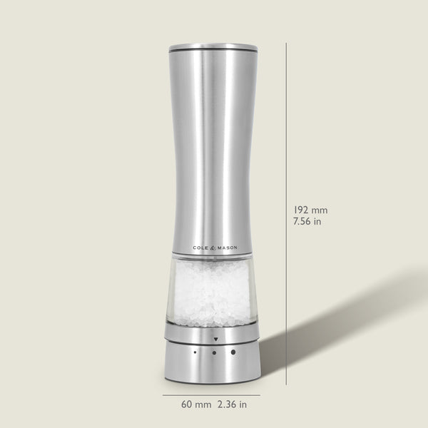 Sleek, tall Cole & Mason Electric Derwent Salt Mill in silver, featuring a transparent lower section that displays the salt crystals; measures 192 mm (7.56 in) in height and 60 mm (2.36 in) in width with the Cole & Mason logo on the grinder.