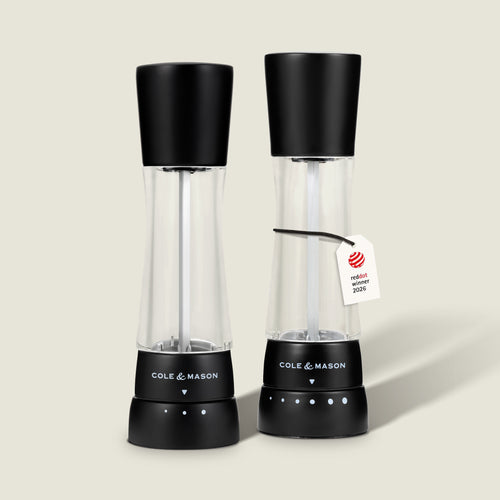 Two Cole & Mason Derwent Matt Black Salt and Pepper Mills stand side by side against a plain light background. One of the mills features a tag reading "reddot winner 2023.
