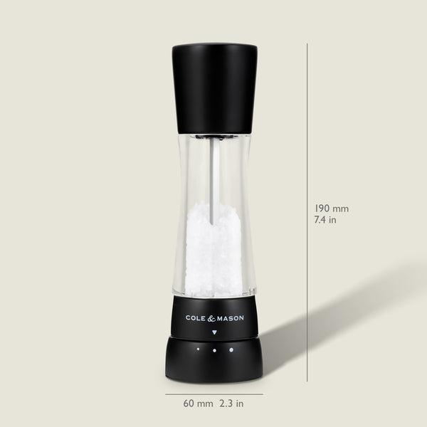 #salt The Cole & Mason Derwent Matt Black Salt & Pepper Mill features a clear acrylic body with a black top, filled with salt crystals. It stands upright, measuring 190 mm (7.4 in) high and 60 mm (2.3 in) wide at the base.