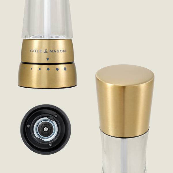 The Cole & Mason Derwent Gold Salt & Pepper Mills in gold-tone stainless steel are displayed from three angles: side view with grind settings, top view of cap, and bottom view showing advanced grinding technology.