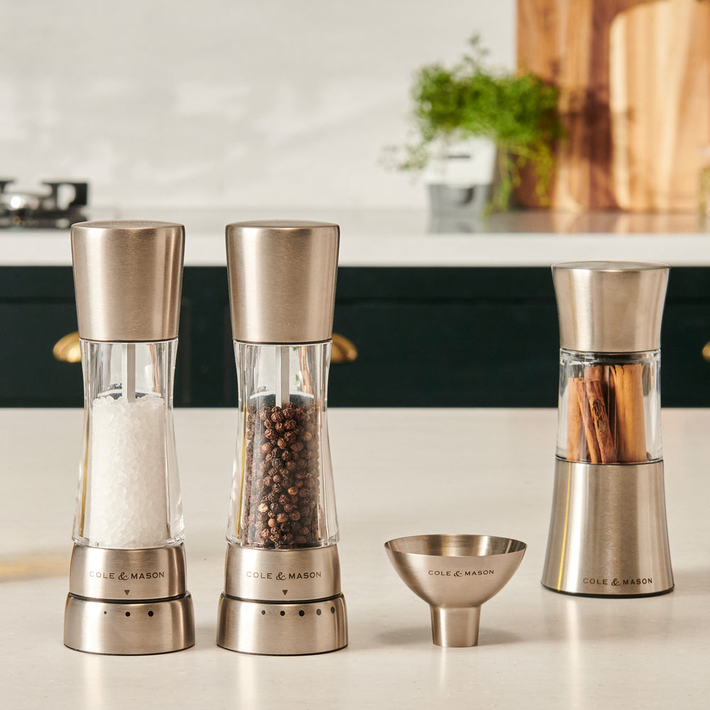 The Cole & Mason Dover Stainless Steel Funnel is an easy-to-clean kitchen essential, designed for effortless pouring and featuring signature Cole & Mason branding against a light, pale background.