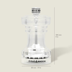 The Cole & Mason Acrylic Salt Shaker & Pepper Mill Set features a clear body with signature branding. Each adjustable grinder stands 104 mm (4 in) tall and 50 mm (1.9 in) wide, displayed against a light beige background.