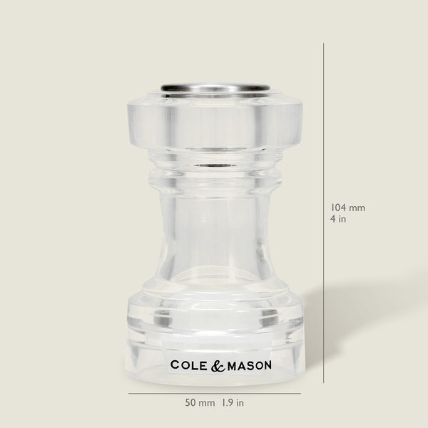 The Cole & Mason Acrylic Salt Shaker & Pepper Mill Set, measuring 104 mm (4 in) tall and 50 mm (1.9 in) wide, is shown upright on a neutral background. This versatile adjustable set serves as both a salt shaker and pepper mill to meet your kitchen needs.