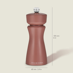 A Cole & Mason Kenton Salt & Pepper Mill in Cinnamon stands upright, measuring 150 mm (6 in) tall and 60 mm (2.4 in) wide, with a curved design and a knob on top. Featuring a durable ceramic grinder, this elegant mill makes a stylish addition to your collection of kitchen accessories.