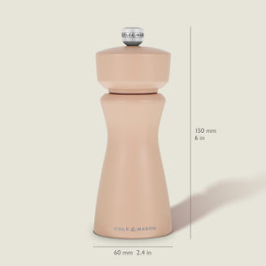 The Kenton Salt & Pepper Mill in Himalayan Salt by Cole & Mason stands upright, measuring 150 mm (6 in) tall and 60 mm (2.4 in) wide. This grinder showcases a smooth, curvy design with a silver knob on top and features a durable ceramic grinding mechanism—ideal for use as a Himalayan salt mill or pepper grinder.