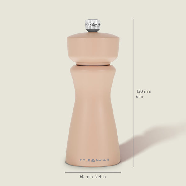 The Kenton Salt & Pepper Mill in Himalayan Salt by Cole & Mason stands upright, measuring 150 mm (6 in) tall and 60 mm (2.4 in) wide. This grinder showcases a smooth, curvy design with a silver knob on top and features a durable ceramic grinding mechanism—ideal for use as a Himalayan salt mill or pepper grinder.