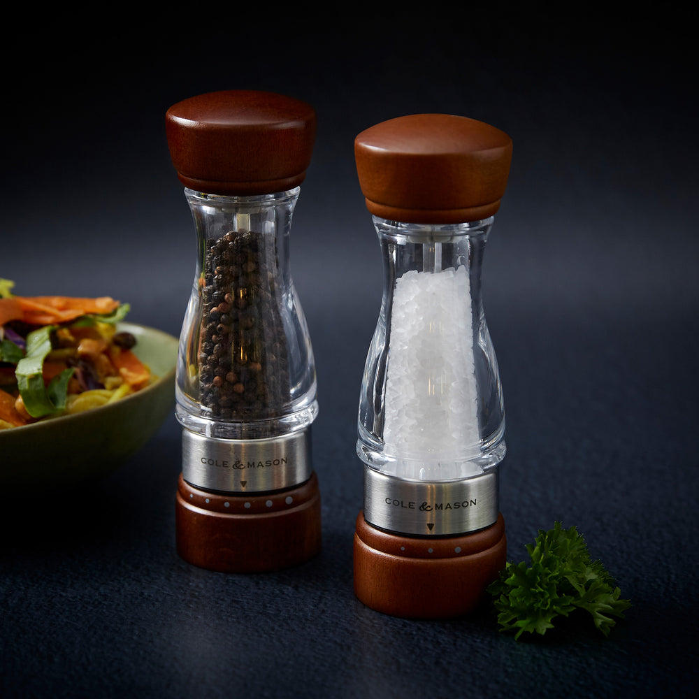 #salt
The Cole & Mason Keswick Salt & Pepper Mills feature a clear, durable acrylic body with a forest stained wood top and base, filled with salt, and finished with a metal band—ideal for gourmet seasoning.