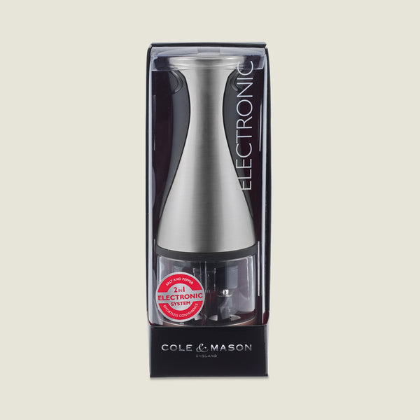 The Cole & Mason Kew Electronic 2-in-1 Duo Mill, a stainless steel salt and pepper grinder with adjustable grind settings, is shown in its original black and clear packaging with product info visible.