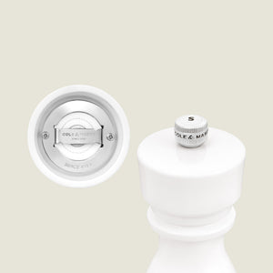 The Cole & Mason London White Acrylic Salt & Pepper Mill (150mm) features an adjustable grinding mechanism and a silver knob, bringing elegant, contemporary style to your kitchen accessories.