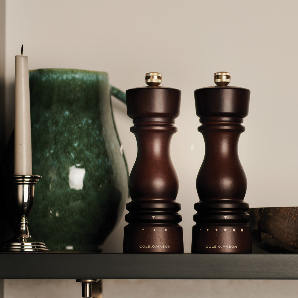 The Mix & Match #3 set by Fast Bundle features two dark wood salt and pepper mills with labels, a small metal funnel, and a clear rectangular tray with circular indentations on a light background.