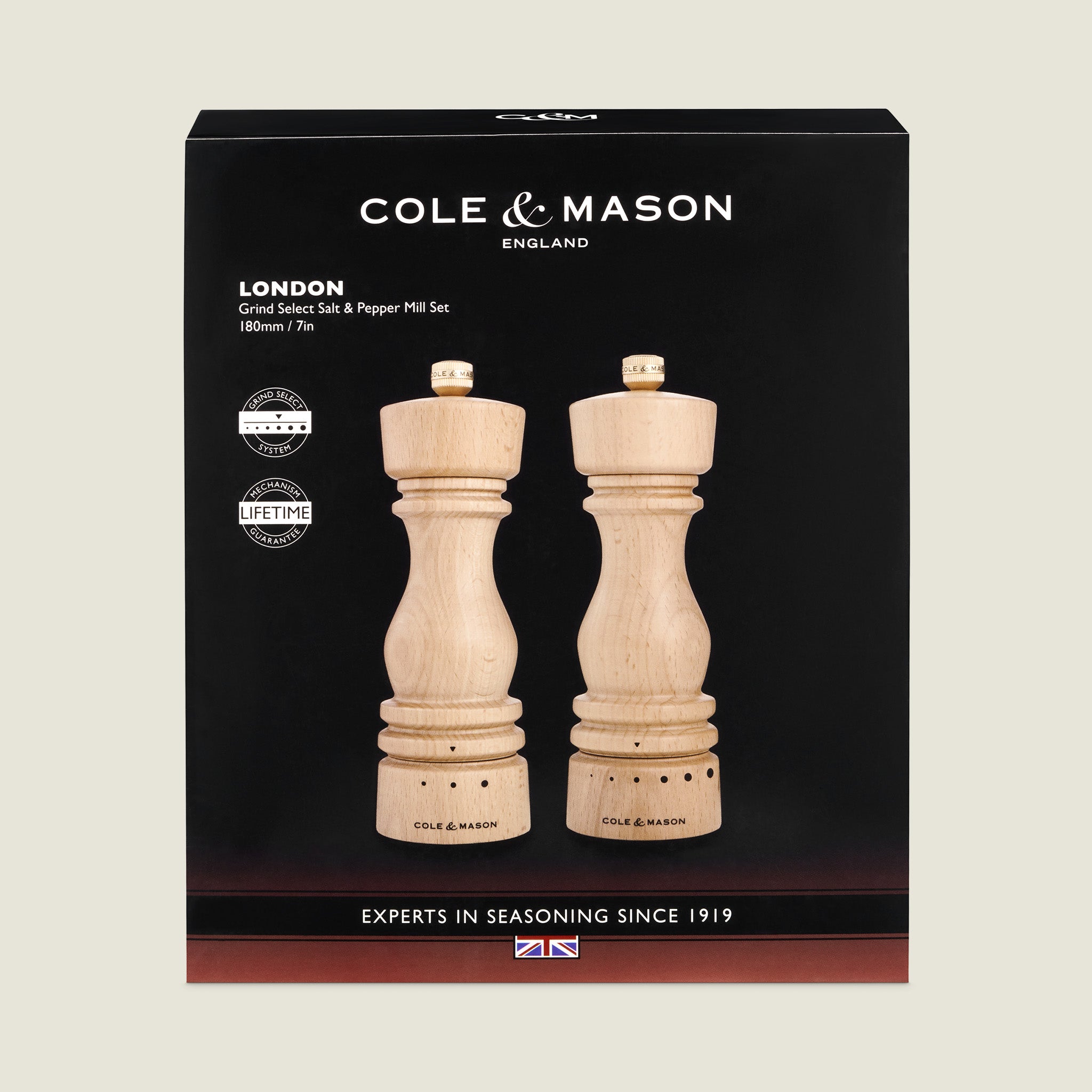 A boxed set of Cole & Mason London salt and pepper mills made of light wood, displayed in black packaging with white text and UK flag, labeled Experts in Seasoning Since 1919.