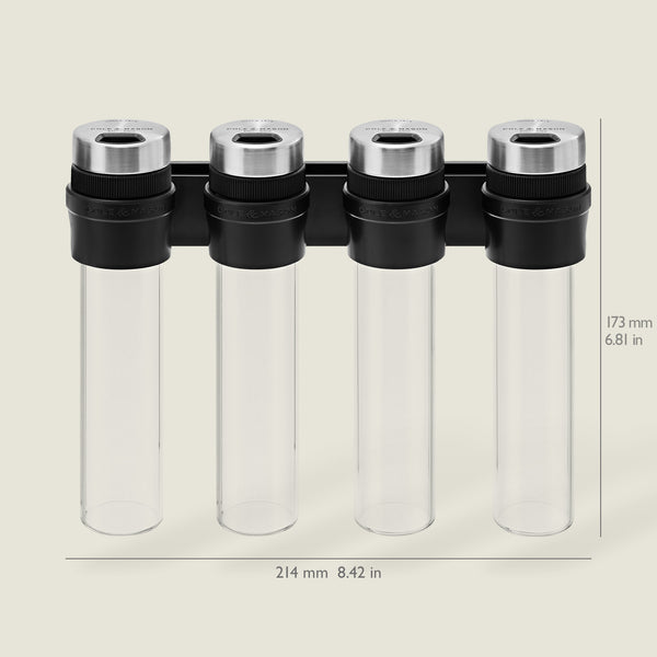 The Cole & Mason Shadwell Slim-Mount Spice Storage features four clear airtight glass containers with silver lids in a black rack, measuring 173 mm high and 214 mm wide.